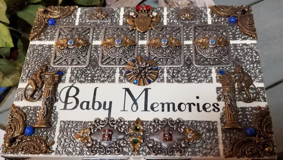 Ornate baby memory keepsake box with jeweled, engraved metal details and Baby Memories text
