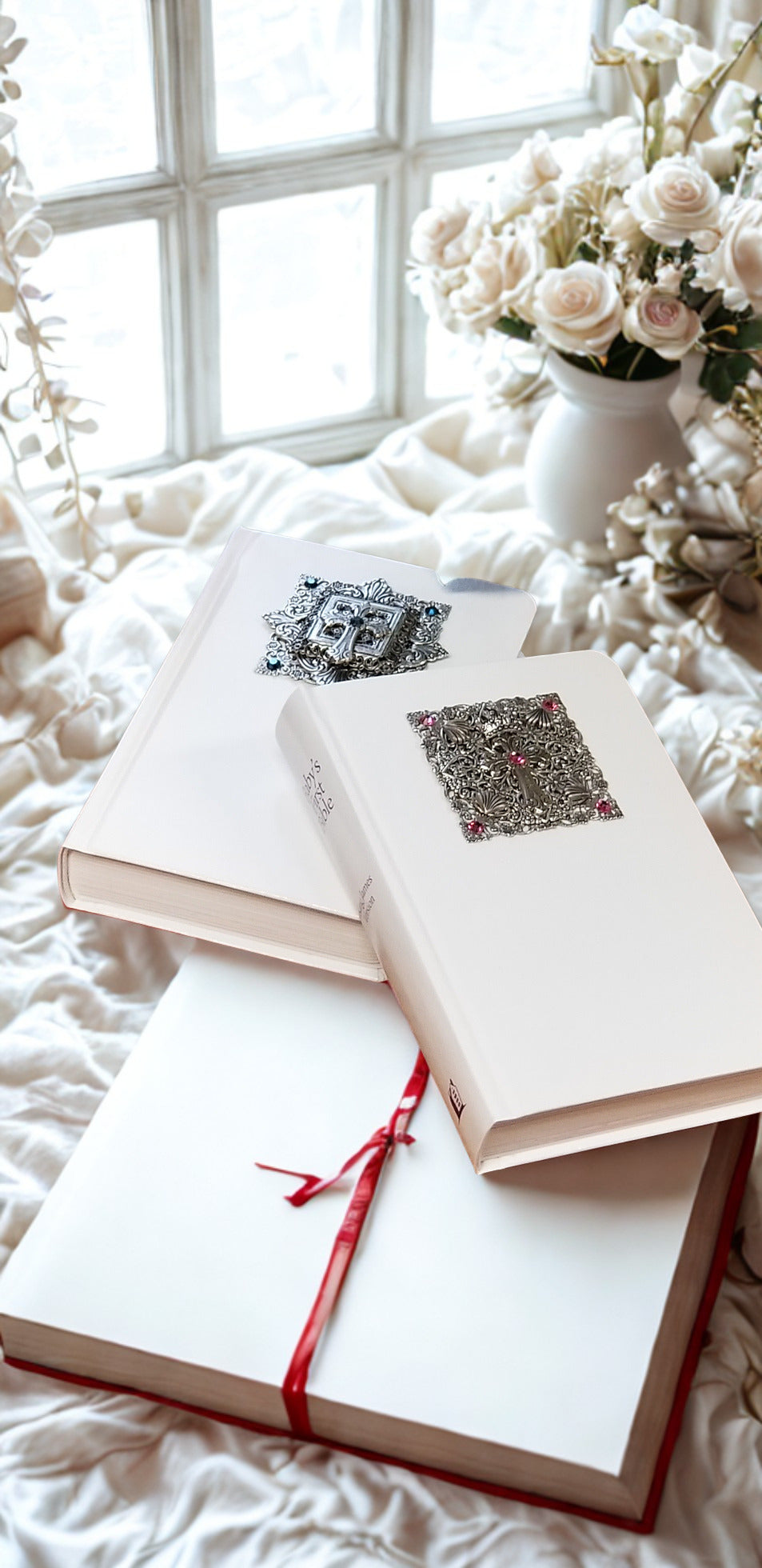 Elegant white keepsake books with ornate cross embellishments, perfect for faith-based gifts and personalized mementos.