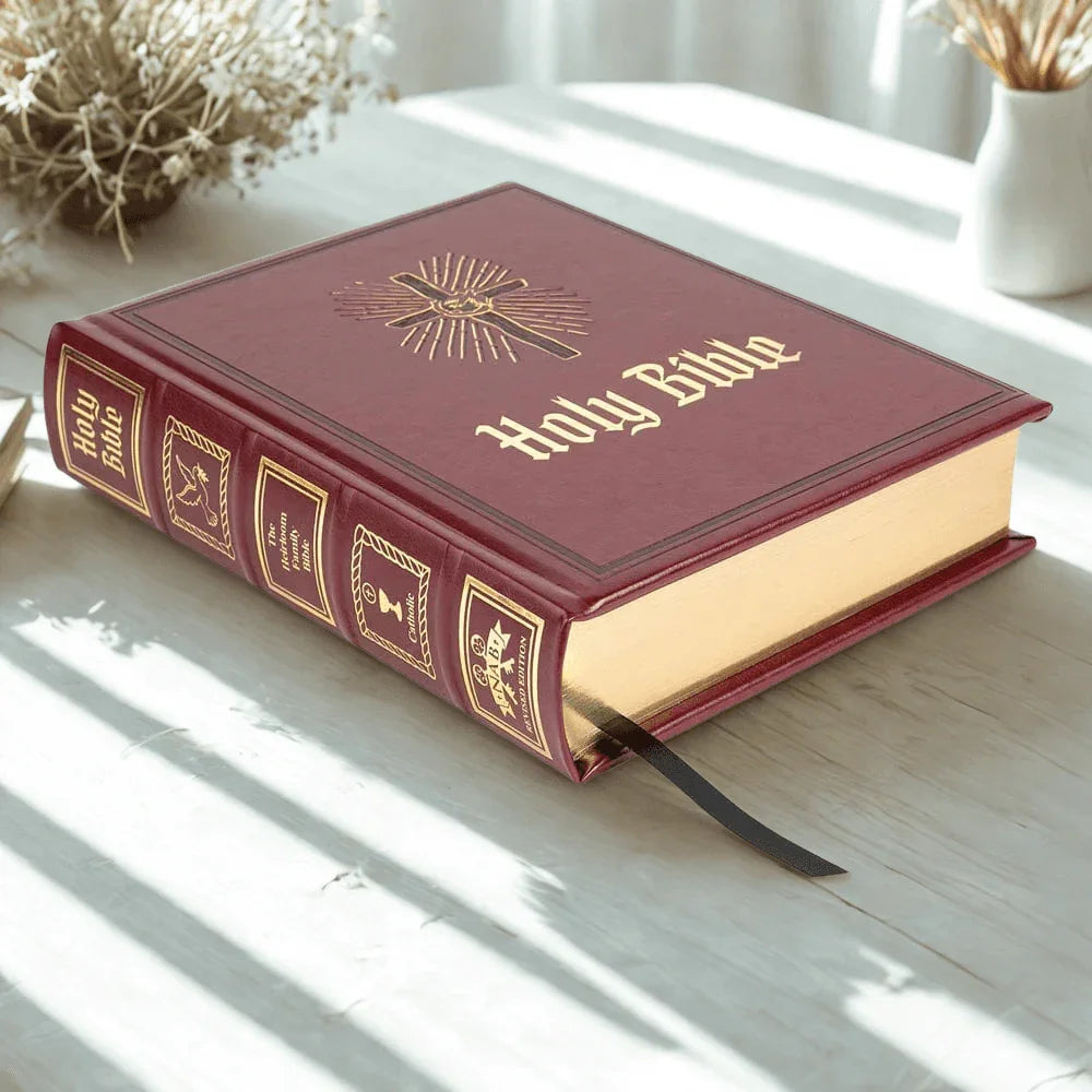 Heirloom Catholic family Bible with maroon cover, gold embossed spine and gilded pages