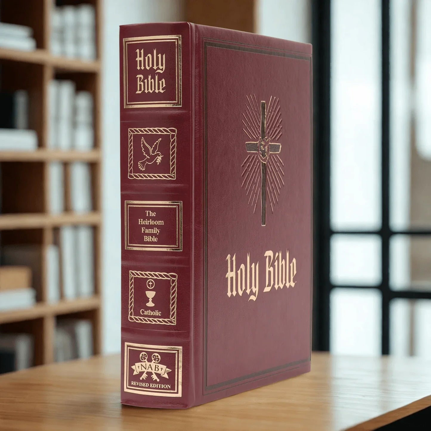 Catholic heirloom family Bible with gold embossed spine and cross on red cover