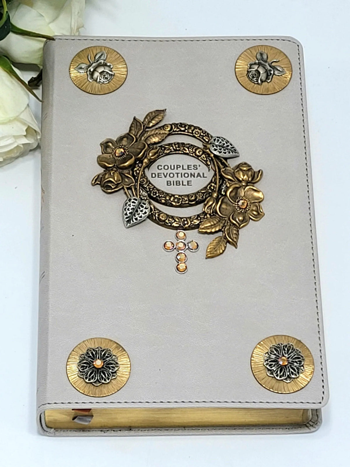 Jeweled couples devotional Bible with gray cover, floral gold accents, and gemstone cross.