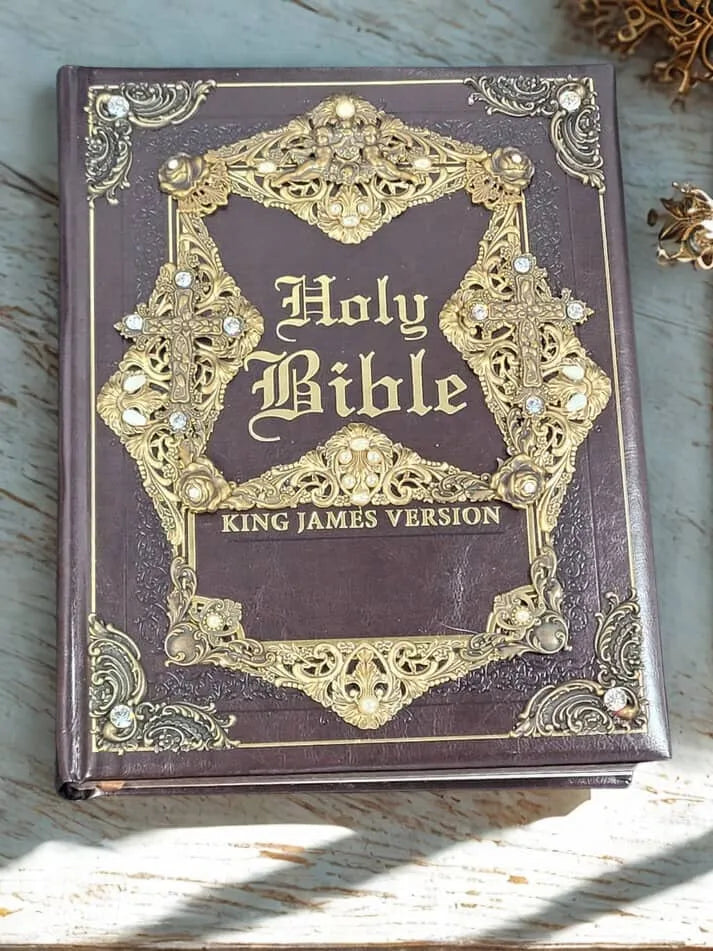 Holy Bible King James Version with ornate gold cover and gemstone accents