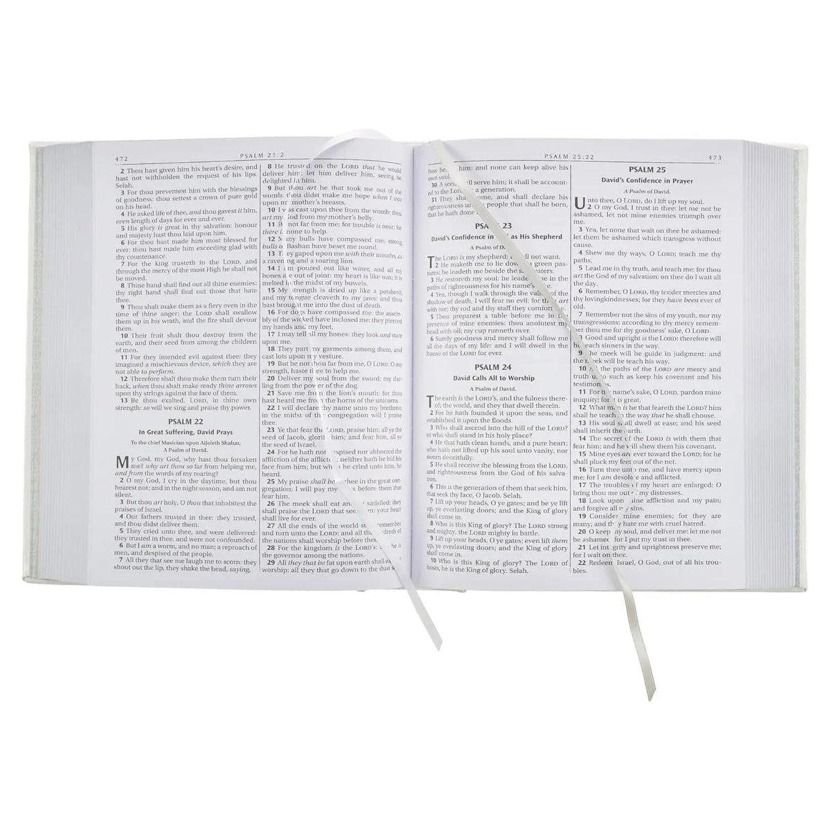 Open white faux leather King James Bible showing Psalms with ribbon markers