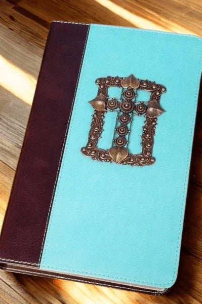 Jeweled KJV Bible giant print teal cover with ornate cross on wood background