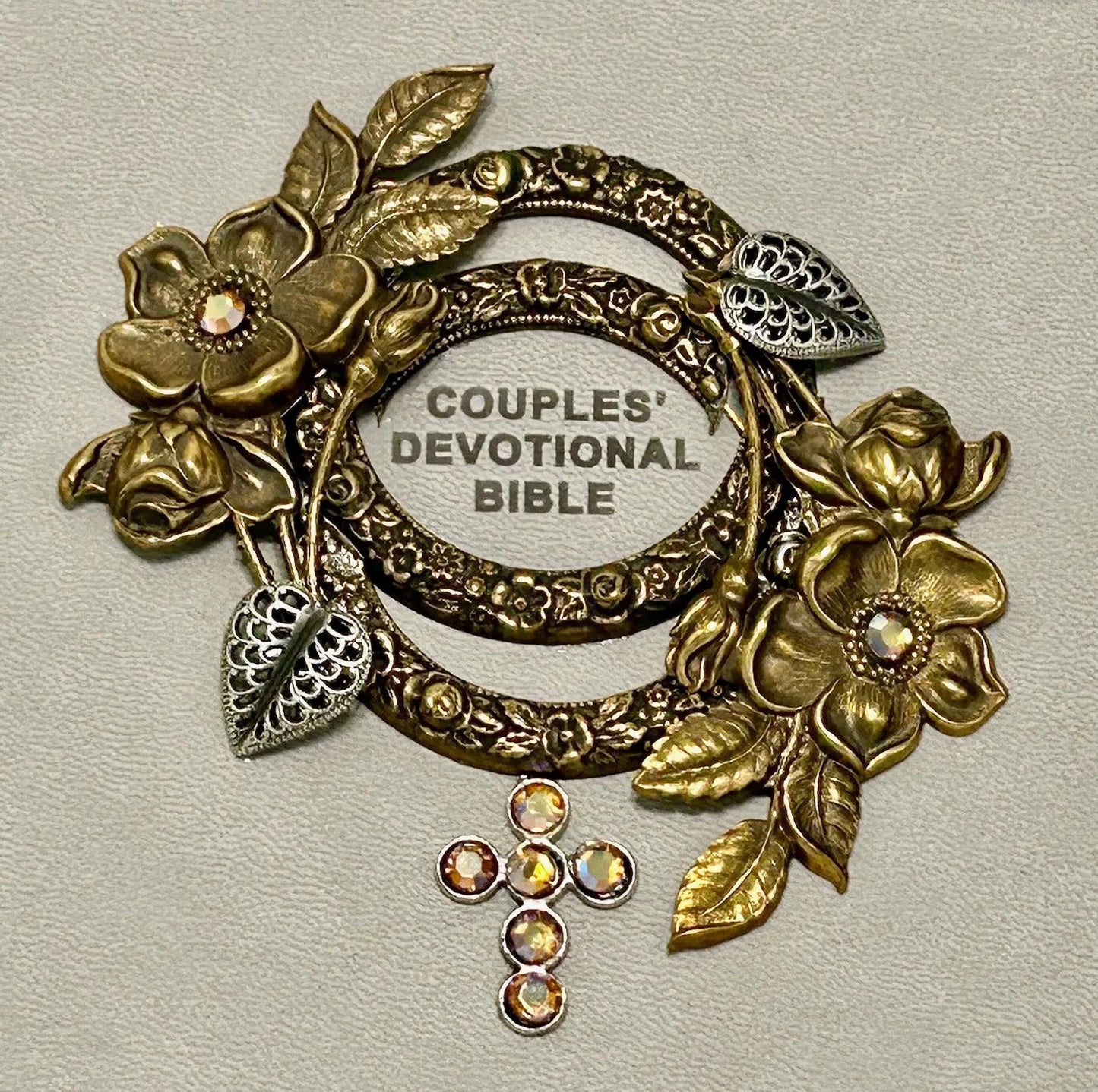 Jeweled couples' devotional Bible with gold floral embellishments and gemstone cross detail