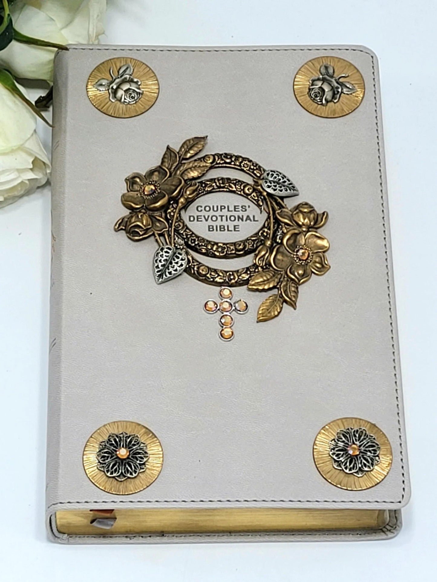 Jeweled couples devotional Bible with gray cover, floral gold accents, and gemstone cross.