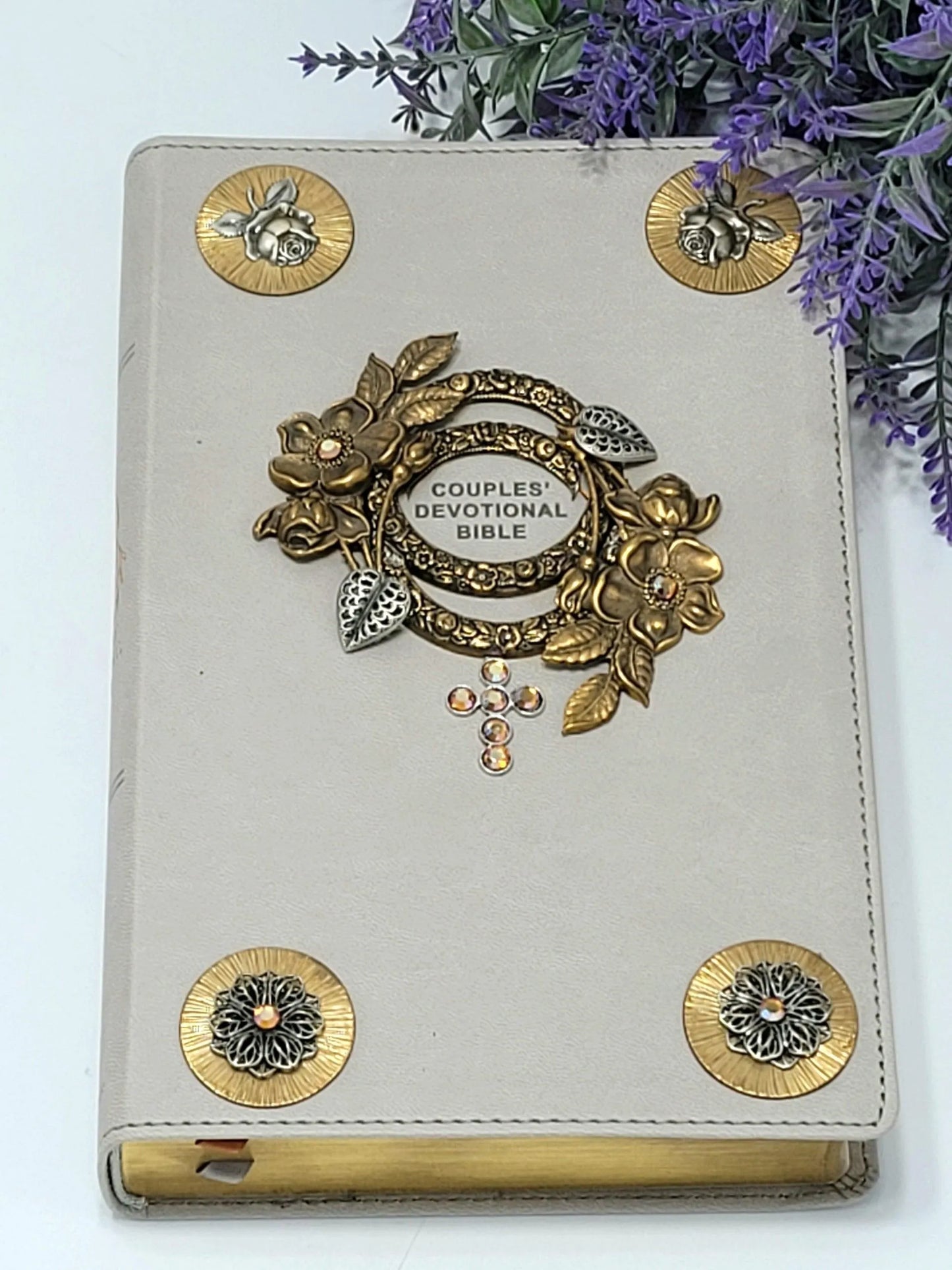 Jeweled couples devotional Bible with gray cover, gold floral embellishments, and crystal cross.