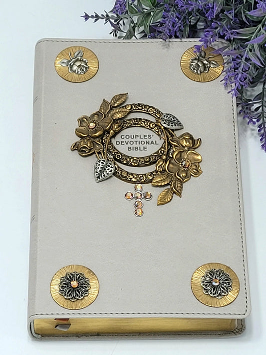 Jeweled couples devotional Bible with gray cover, gold floral embellishments, and crystal cross.