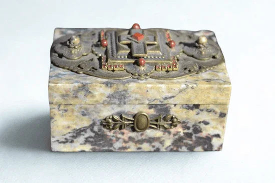 Jeweled soapstone keepsake box with ornate metal cross and red gemstone accents on lid