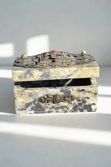Jeweled soapstone keepsake box open, featuring ornate metal and gemstone accents