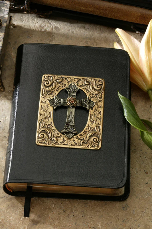 Jeweled Bible with ornate metal cross and amber crystal on black cover