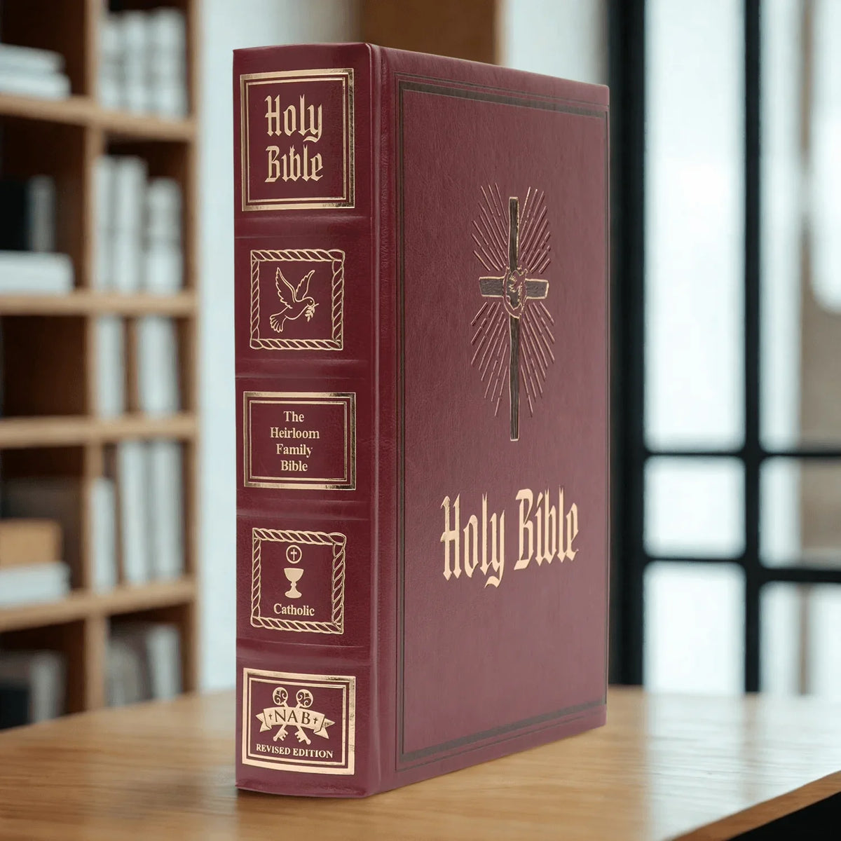 Catholic heirloom family Bible with gold embossed spine and cross on red cover