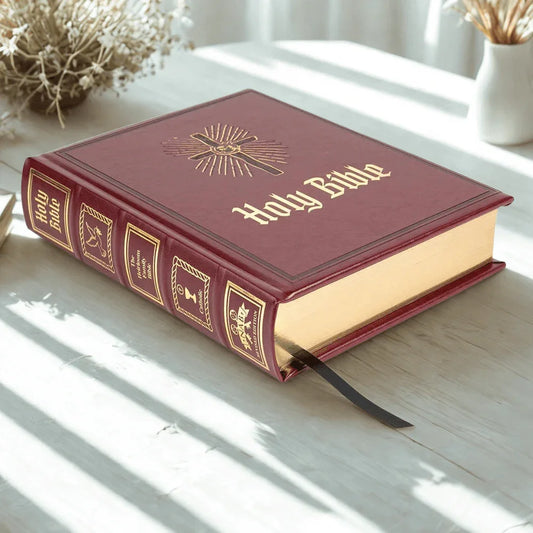 Heirloom Catholic family Bible with maroon cover, gold embossed spine and gilded pages
