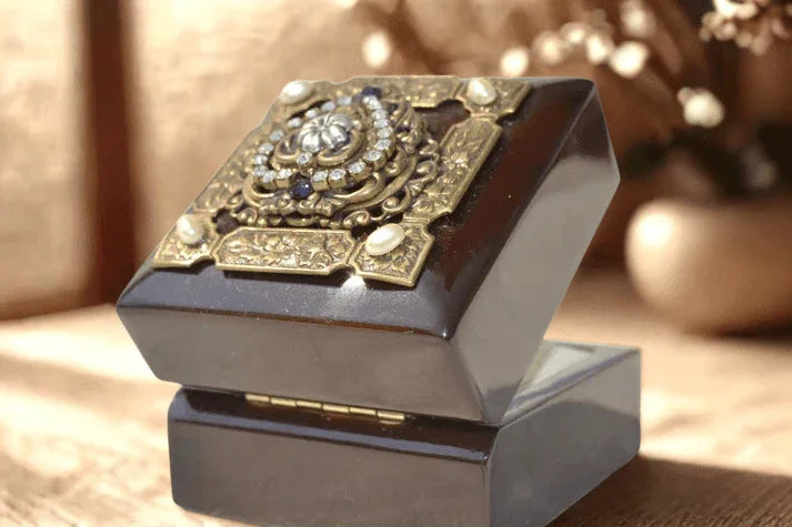 Purple heart wood keepsake box opened, ornate jeweled lid, warm light background