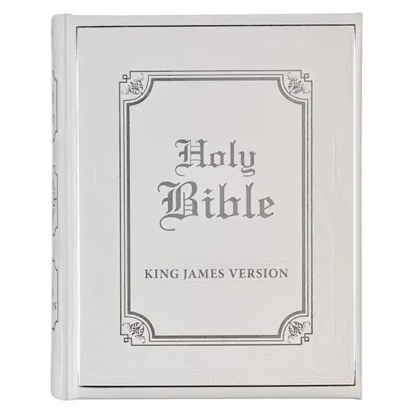 White faux leather King James Bible with ornate silver-embossed cover design