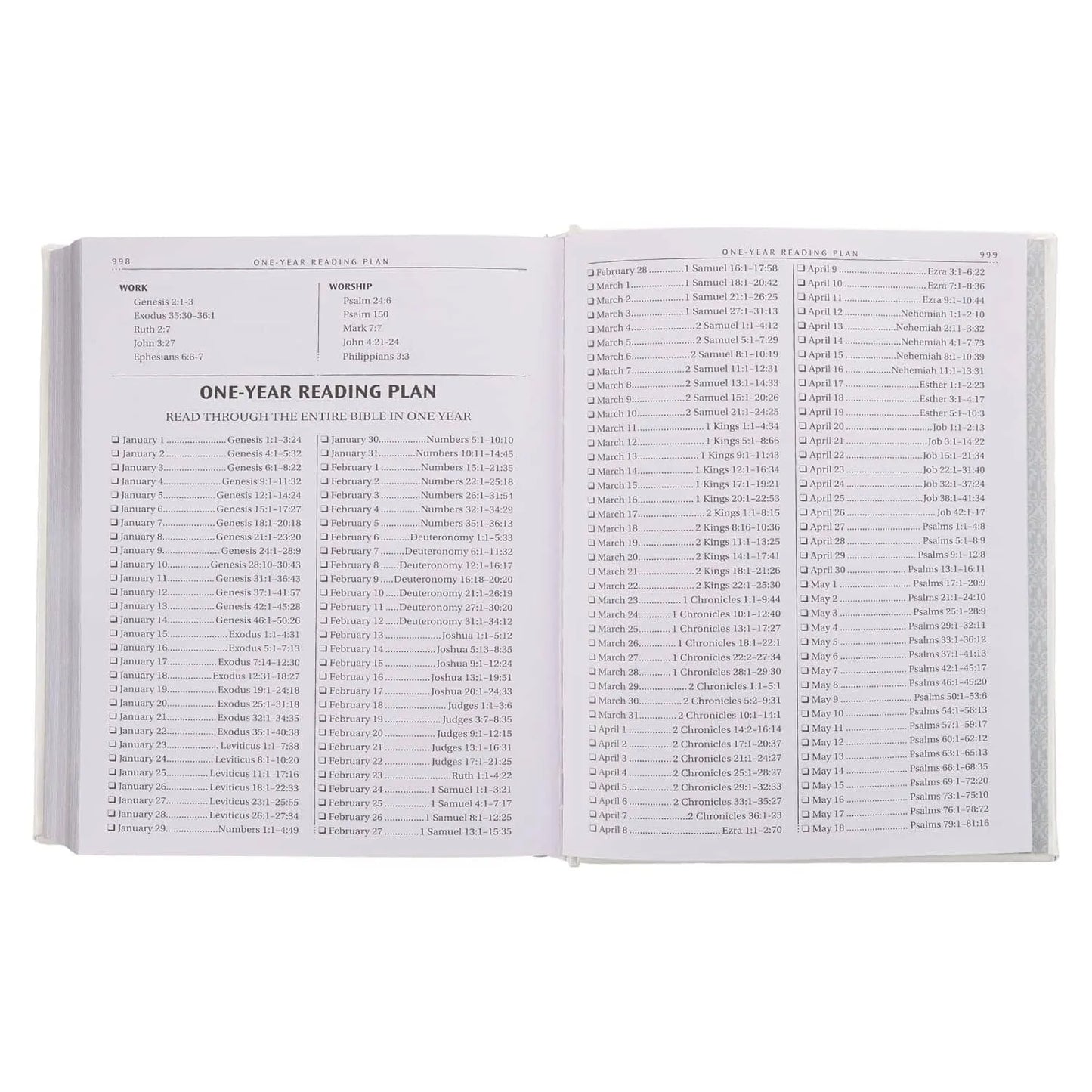 Open Bible showing a one-year Bible reading plan with daily scripture references.