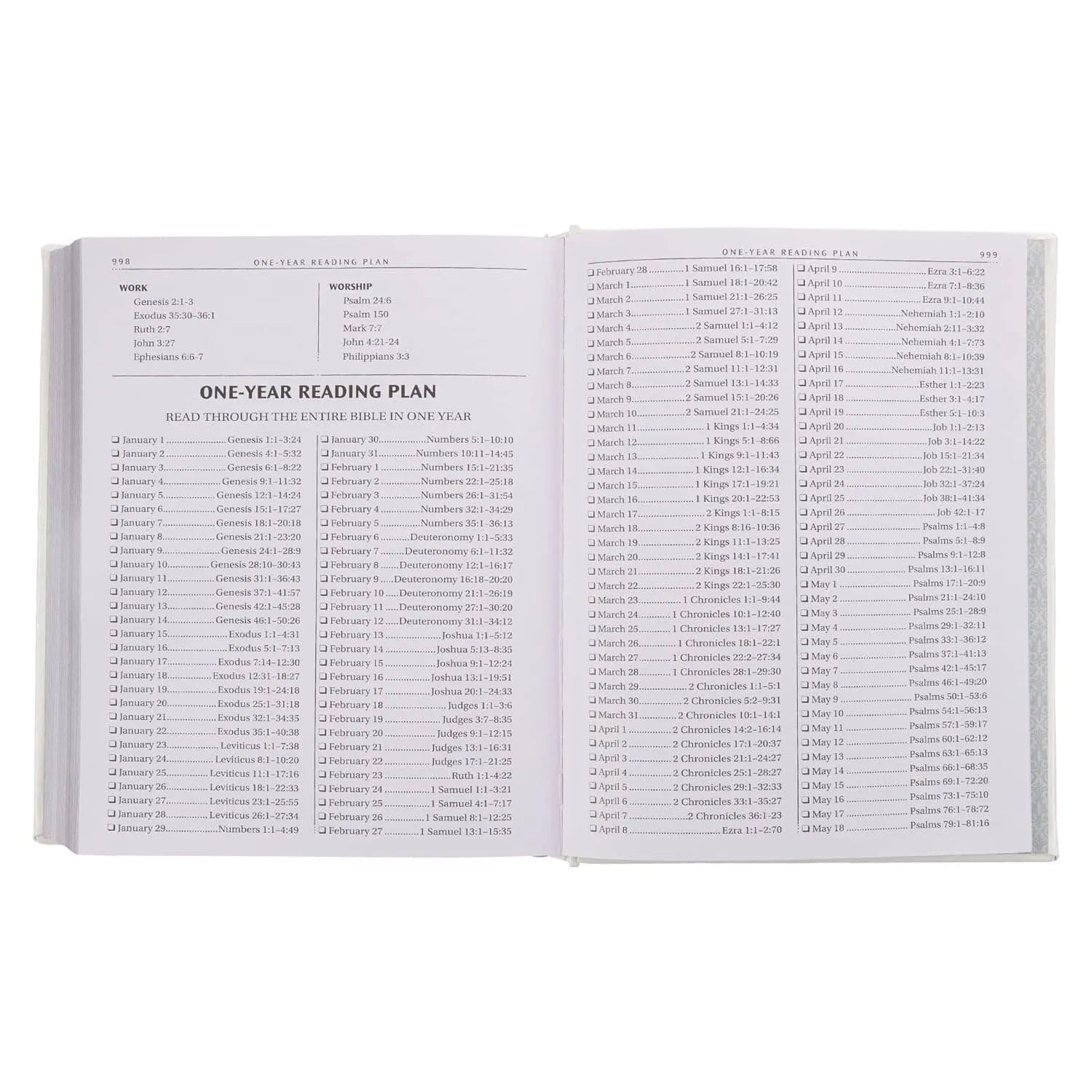 Open Bible showing a one-year Bible reading plan with daily scripture references.