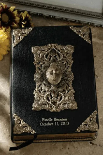 Black leather Bible with ornate silver embellishments and personalized engraving