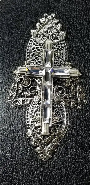 Jeweled Bible with ornate silver filigree and crystal cross on textured black cover