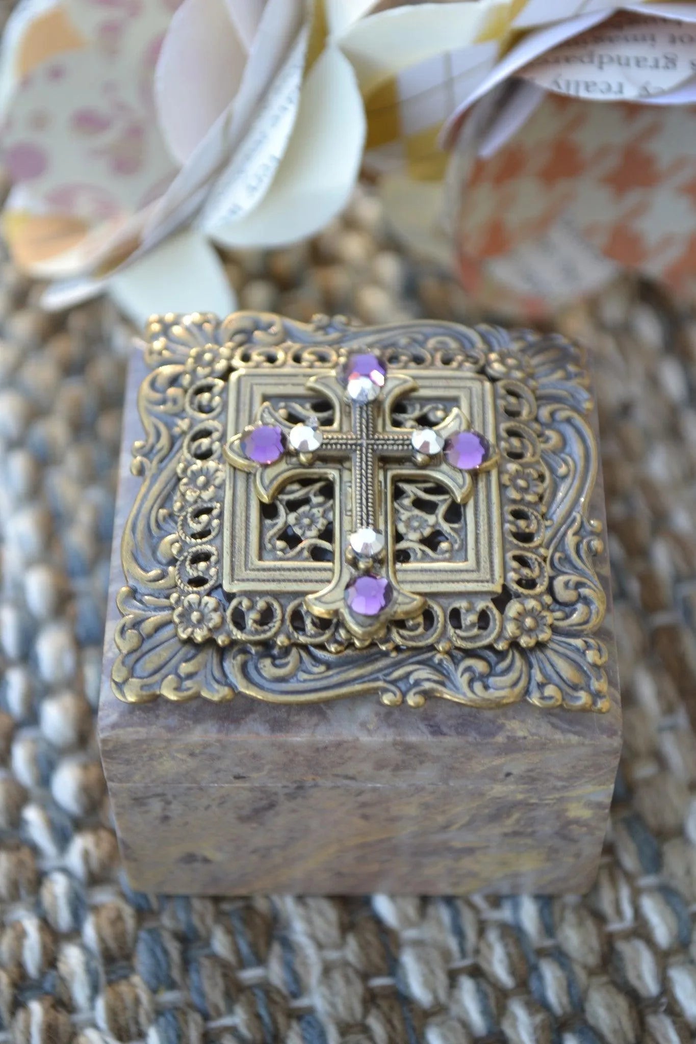Antique bronze ornate box with jeweled crystal cross and purple accents
