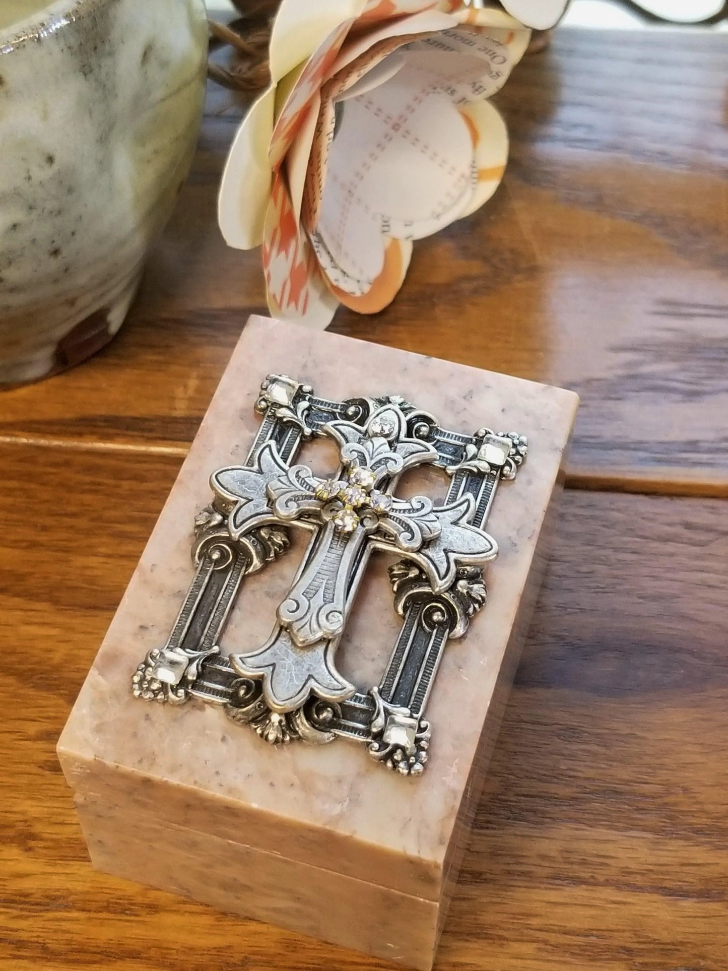 Jeweled faith keepsake box with ornate metal cross on marble base