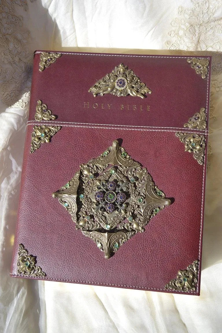 Jeweled leather family Bible with ornate gold corner designs and gemstone embellishments