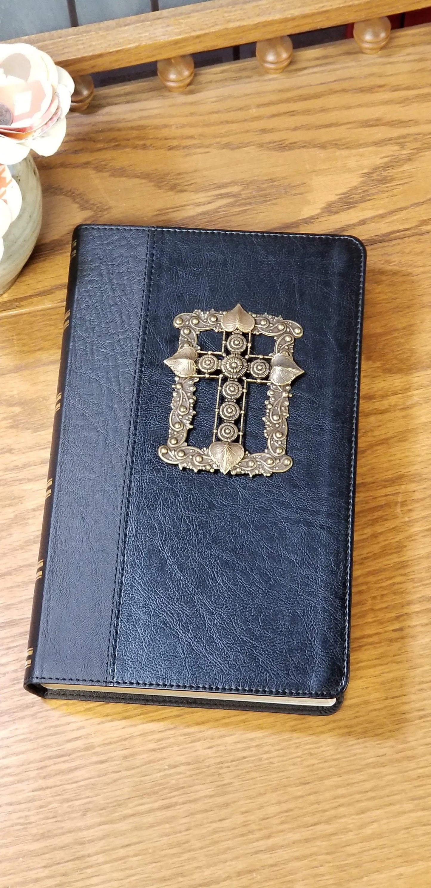 Jeweled KJV Bible with giant print, black leather cover, ornate gold cross on wooden table