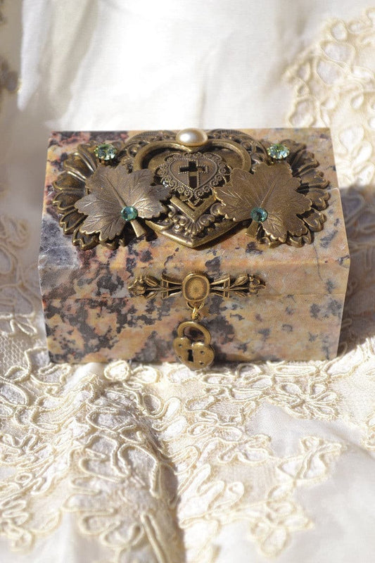 Jeweled soapstone keepsake box with ornate heart, leaf accents, and green gemstones